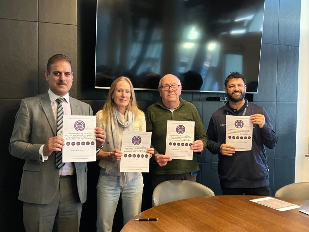 From left: Basharat Hussain alongside Jane Pratt President of the Airedale & Wharfedale Senior Cricket League, Alan Birkinshaw, Chief Executive of The Gordon Rigg Bradford Premier League, and Mo Hussain, Equality, Diversity and Inclusion Manager for YCCC, after signing the Yorkshire and Humber Anti-Racism in Sports Group anti-racism pledge. 