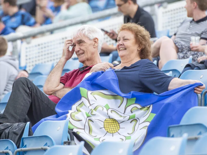 A Yorkshire fan with a big Yorkshire flag in the stands at Headingley.
