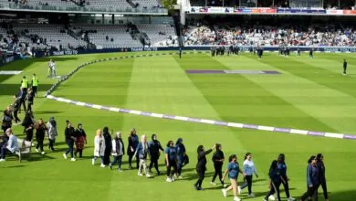 A group of volunteers on a lap of honour at Lord's in 2022.