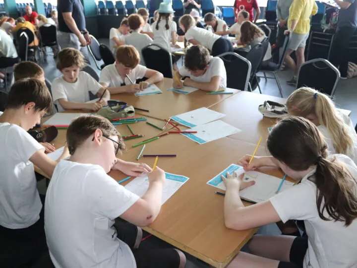 School children designing a Yorkshire shirt at Headingley.