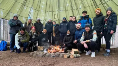 The Yorkshire Cricket Foundation staff at a team building away day in December 2022, gathered around the fire