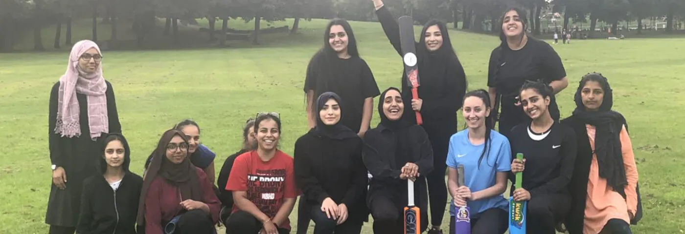 Women's cricket team celebrating a win from a YFC hundred tournament