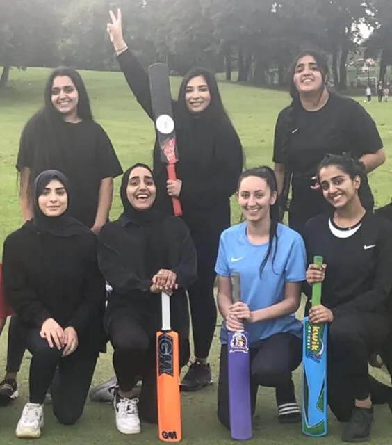 Women's cricket team celebrating a tournament win from a YFC hundred tournament