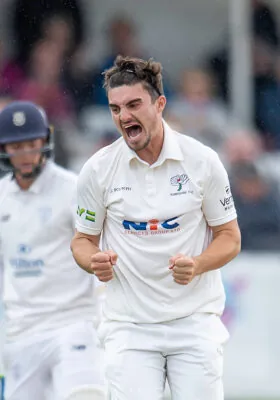 Jordan Thompson celebrates taking a wicket in the County Championship.