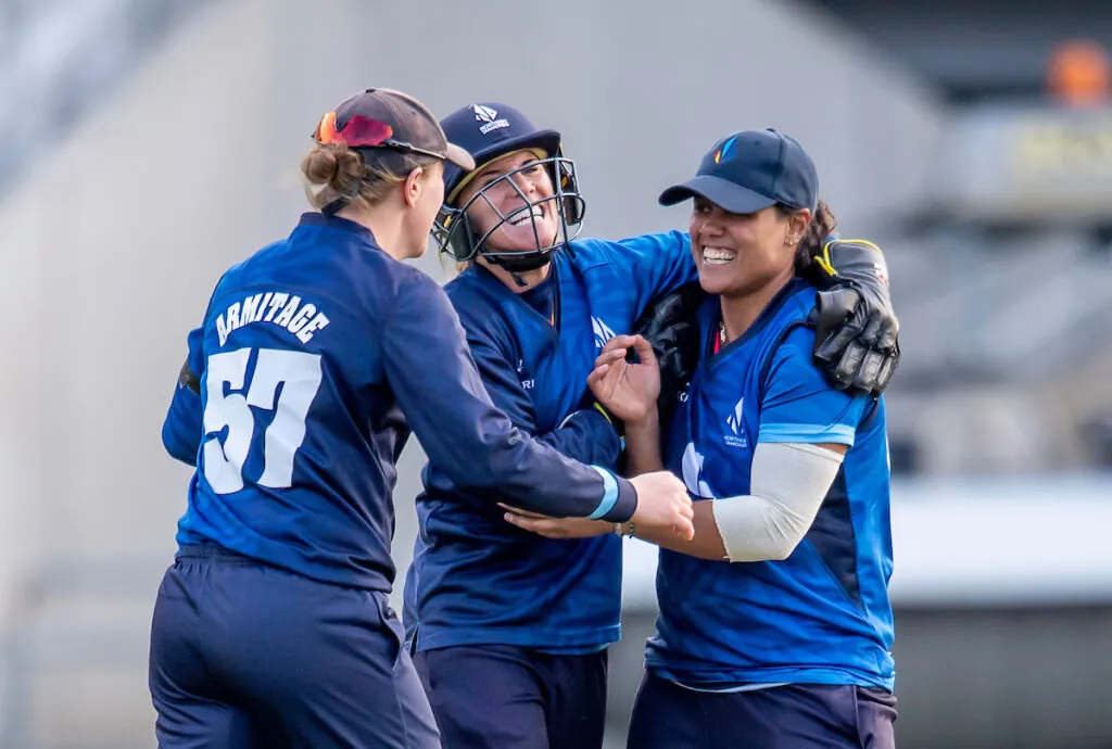 Northern Diamonds' Chloe Tryon (r) is pictured being congratulated on taking a catch to dismiss Western Storm's Chloe Skelton by Hollie Armitage and Lauren Winfield-Hill.