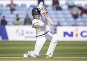 James Wharton drives on the way to his maiden first-class fifty