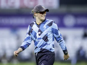 Northern Diamonds captain Hollie Armitage smiling whilst fielding at Headingley