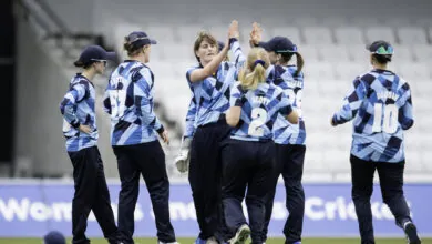Northern Diamonds players celebrate taking a wicket at Headingley
