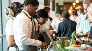 Staff serve food and drinks at Headingley Cricket Hospitality